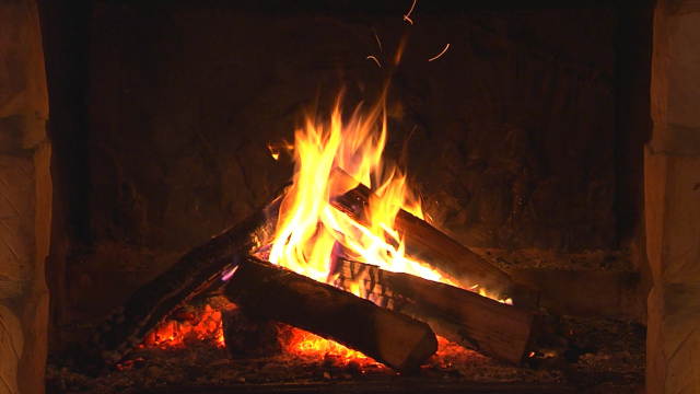 Fireplace burning logs center flames free wallpaper for desktop - medium preview image
