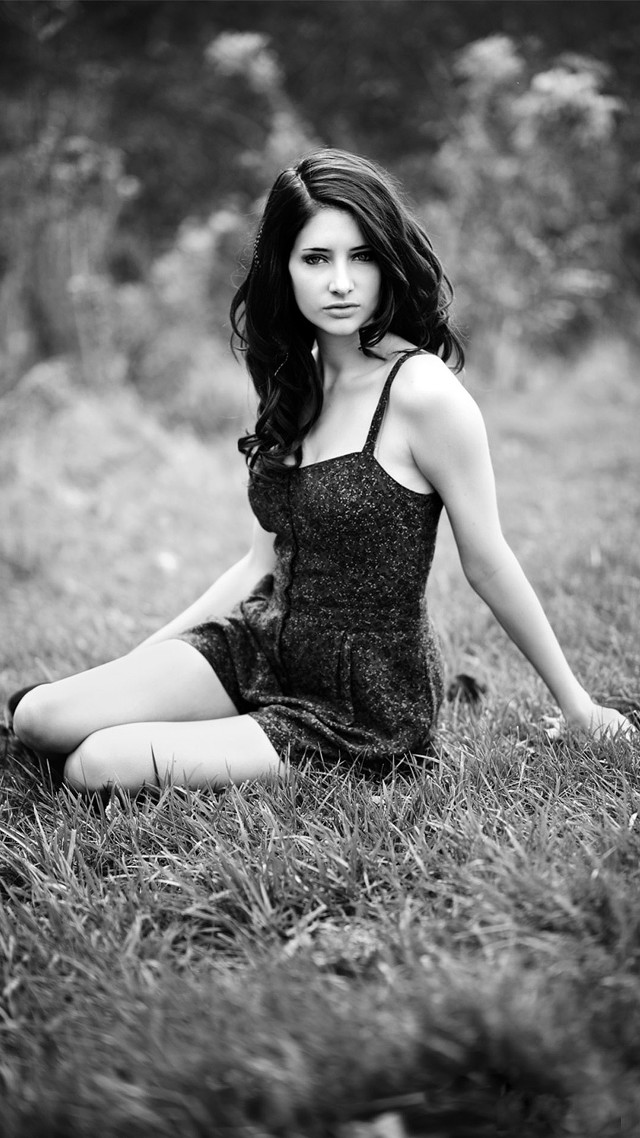 Woman sitting field blurry monochrome free wallpaper for mobile - medium preview image