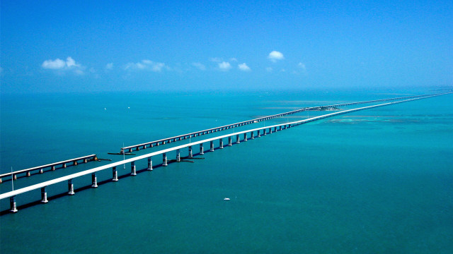 Long bridge spanning ocean blue free wallpaper for desktop - medium preview image