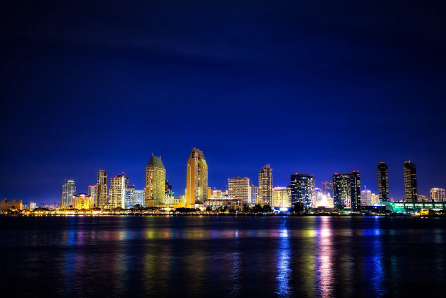 City skyline night water lit free wallpaper for desktop - medium preview image