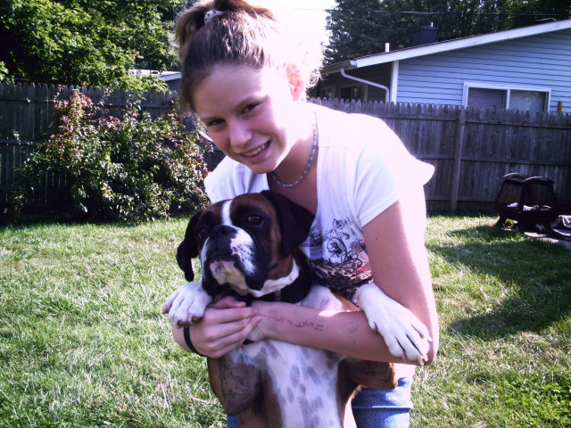 Woman holding dog grass house free wallpaper for desktop - medium preview image