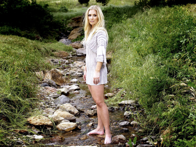 Woman standing stream field grass free wallpaper for desktop - medium preview image