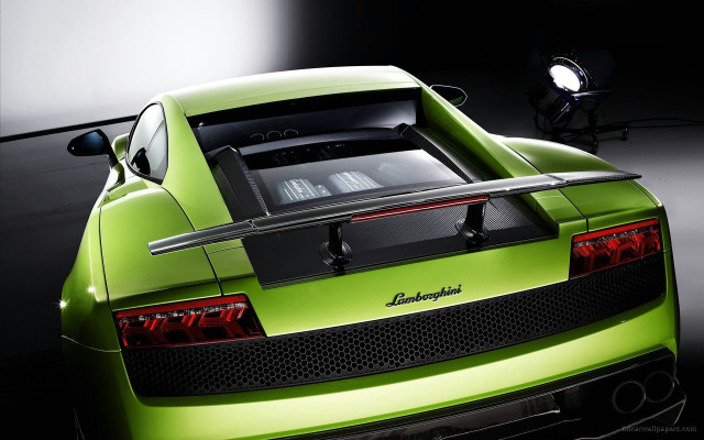 Green sports car garage spotlight free wallpaper for desktop - medium preview image