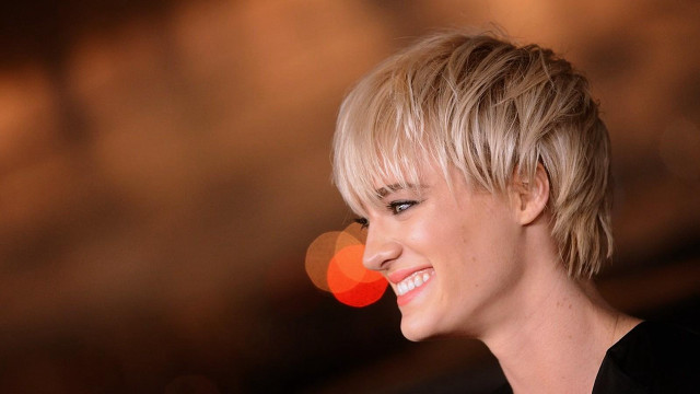Woman blonde haircut smiling camera free wallpaper for desktop - medium preview image