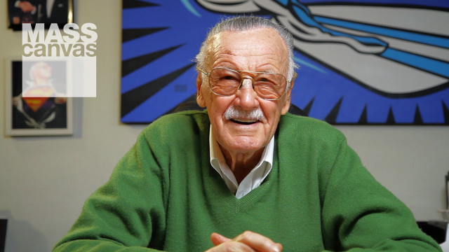 Man green sweater table blurry free wallpaper for desktop - medium preview image