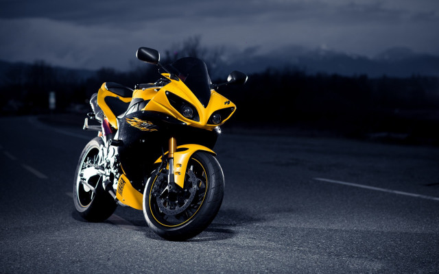 Yellow motorcycle parked night dark free wallpaper for desktop - medium preview image