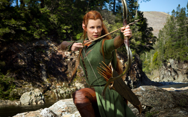 Woman green dress bow arrow #2 free wallpaper for desktop - medium preview image