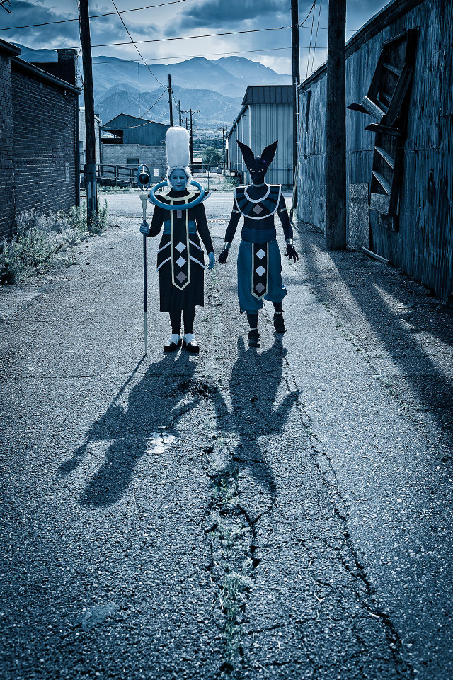 Costumed couple holding hands walking free wallpaper for mobile - medium preview image