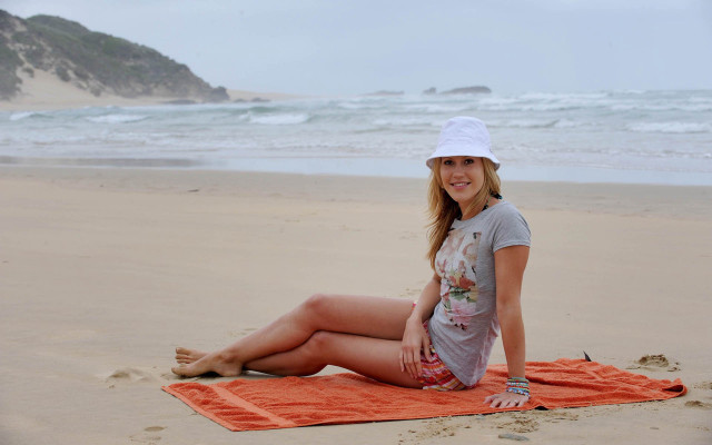 Woman beach towel smiling camera free wallpaper for desktop - medium preview image