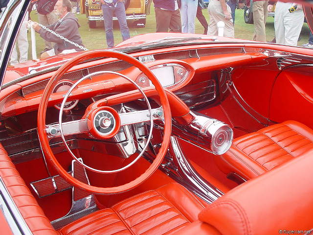 Red car steeringwheel leatherseat retrofuturism free wallpaper for desktop - medium preview image