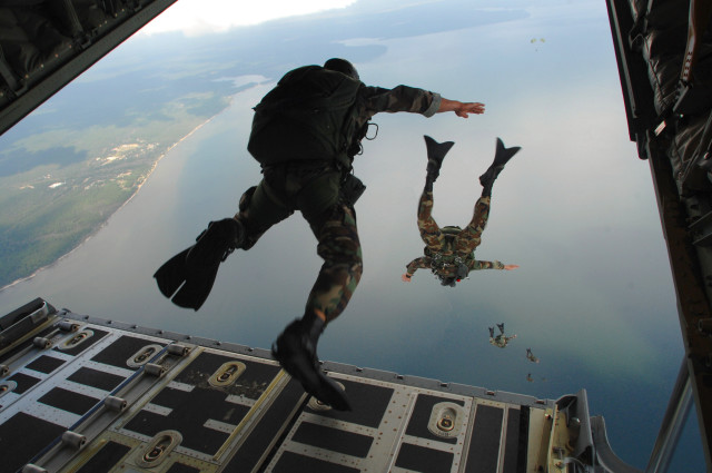 Camouflage man jumps plane water free wallpaper for desktop - medium preview image