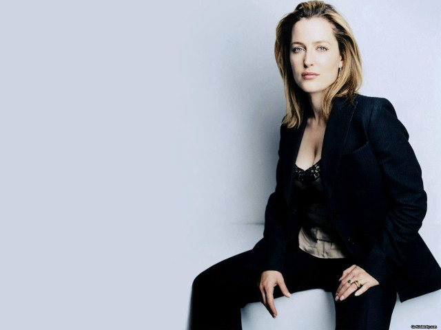 Woman black suit white chair free wallpaper for desktop - medium preview image