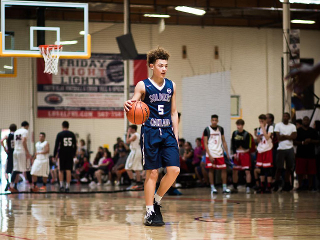 Young man dribbling basketball court free wallpaper for desktop - medium preview image