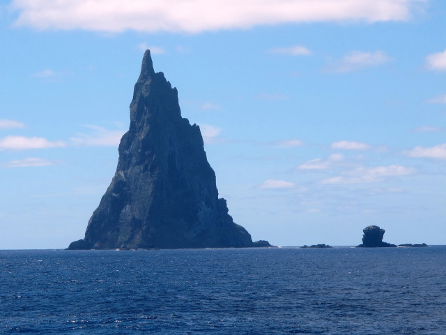 Large rock formation ocean boat #2 free wallpaper for desktop - medium preview image