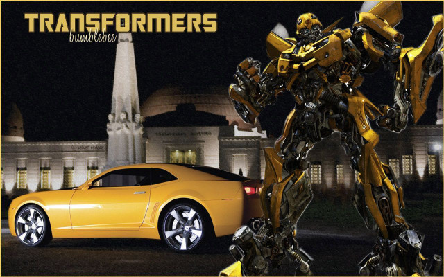Yellow car robot building night free wallpaper for desktop - medium preview image
