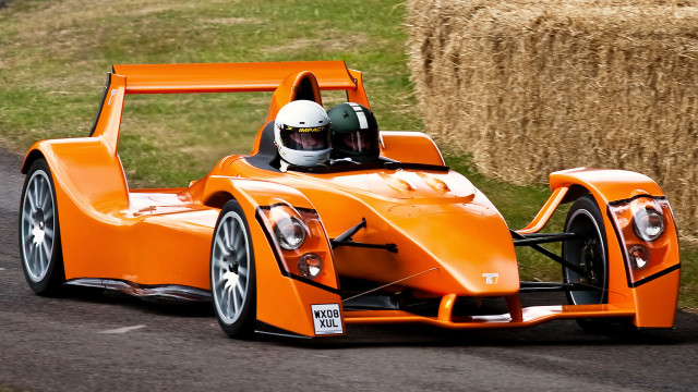 Man orange racecar road hay free wallpaper for desktop - medium preview image