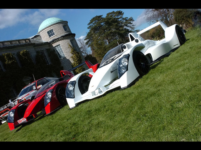 Cars parked lush green field free wallpaper for desktop - medium preview image