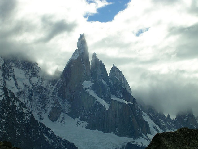 Snowy mountain clouds rocks ground free wallpaper for desktop - medium preview image