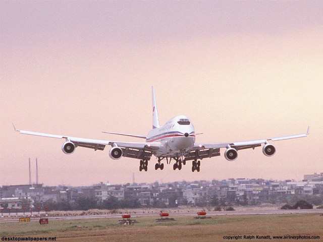 Jetliner cloudy sky city skyline #2 free wallpaper for desktop - medium preview image