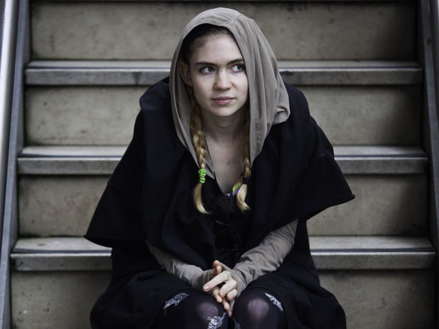 Woman sitting stairs black outfit free wallpaper for desktop - medium preview image