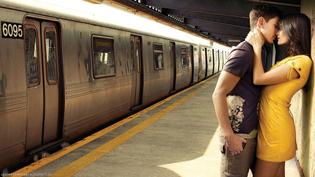 Man woman kissing train station free wallpaper for desktop - medium preview image