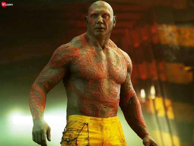 Tattooed man yellow shorts dark free wallpaper for desktop - medium preview image