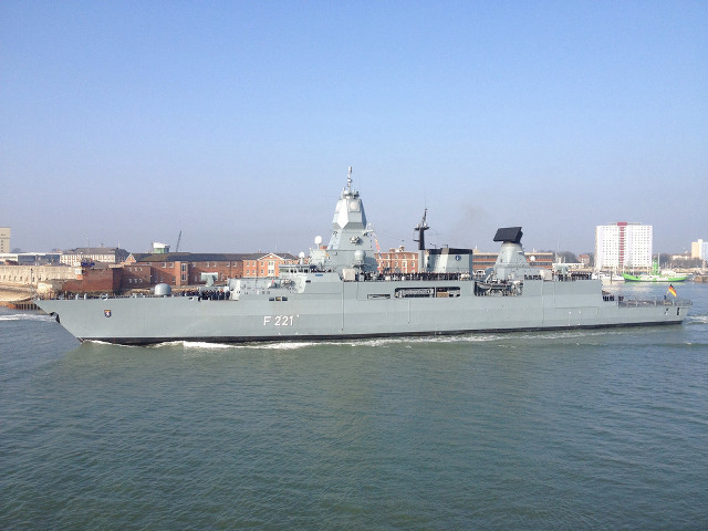 Large gray ship sailing city free wallpaper for desktop - medium preview image