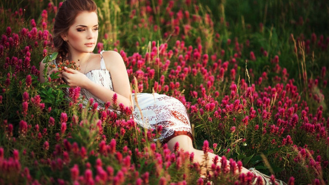 Woman field flowers serious hand free wallpaper for desktop - medium preview image