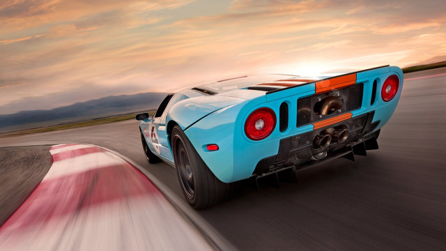 Blue sports car track sunset free wallpaper for desktop - medium preview image
