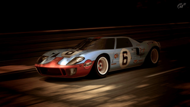 Racing car speeding night track free wallpaper for desktop - medium preview image