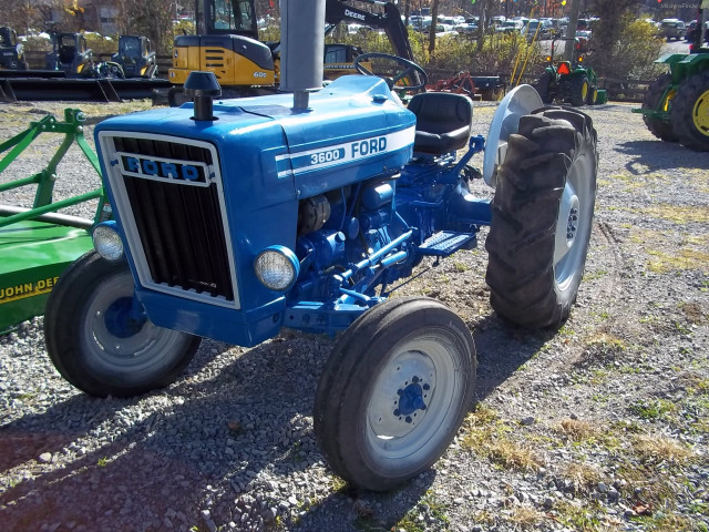 Blue tractor gravel field green free wallpaper for desktop - medium preview image