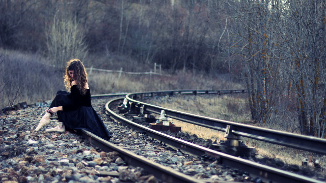 Woman sitting train track cell free wallpaper for desktop - medium preview image