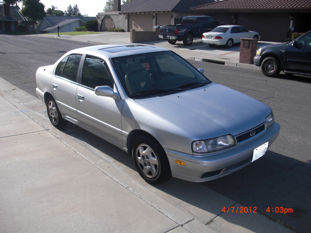 Silver car parked street sidewalk free wallpaper for desktop - medium preview image