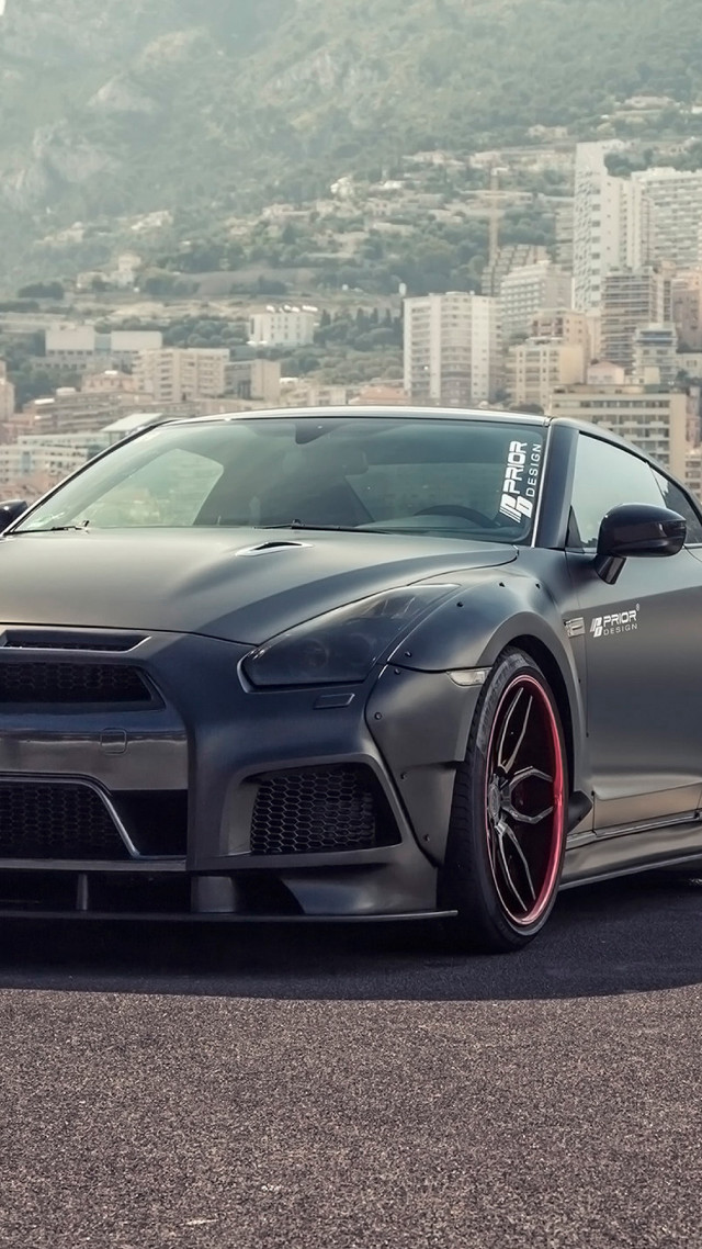 Gray sports car city mountain free wallpaper for mobile - medium preview image