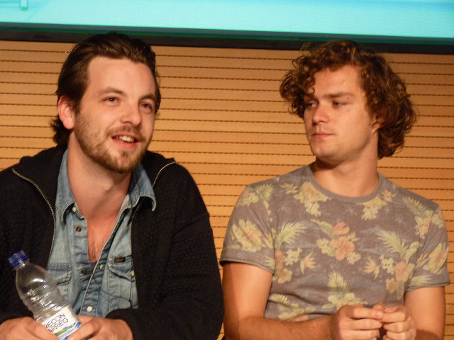 Two men sitting holding bottles free wallpaper for desktop - medium preview image