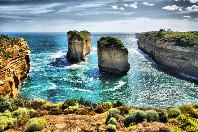 Large water surrounded cliffs beach free wallpaper for desktop - medium preview image