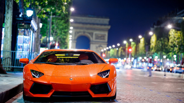 Bright orange sports car night free wallpaper for desktop - medium preview image