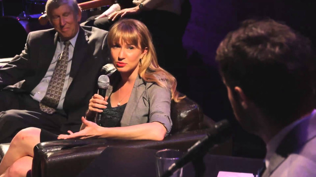 Woman chair microphone man standing free wallpaper for desktop - medium preview image