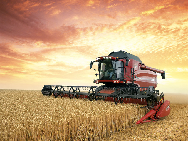 Red combine harvesting wheat cloudy #2 free wallpaper for desktop - medium preview image