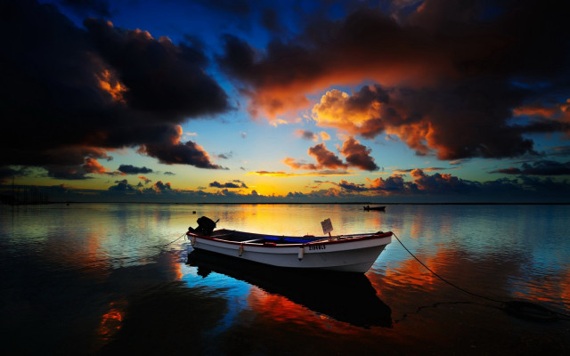 Boat sunset clouds water man free wallpaper for desktop - medium preview image