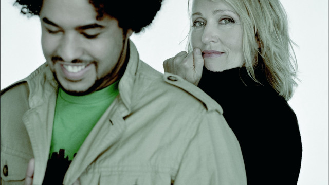 Smiling man woman looking phone free wallpaper for desktop - medium preview image