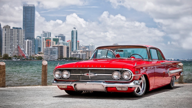 Red car waterfront cityscape cloudy free wallpaper for desktop - medium preview image