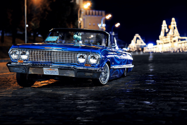 Blue car parked road night free wallpaper for desktop - medium preview image