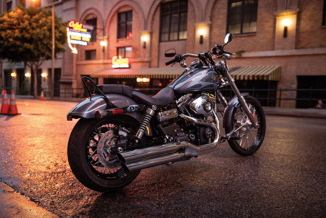 Motorcycle parked night building neon free wallpaper for desktop - medium preview image