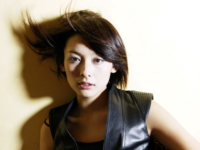 Woman black leather vest hair free wallpaper for desktop - medium preview image