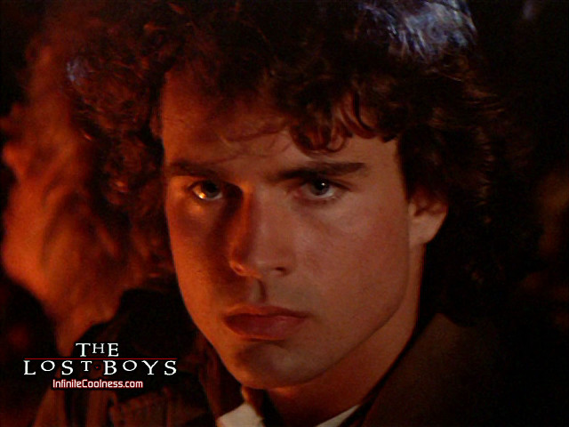 Man curly hair tie serious free wallpaper for desktop - medium preview image