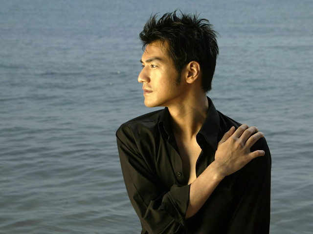 Man standing water hands chest free wallpaper for desktop - medium preview image