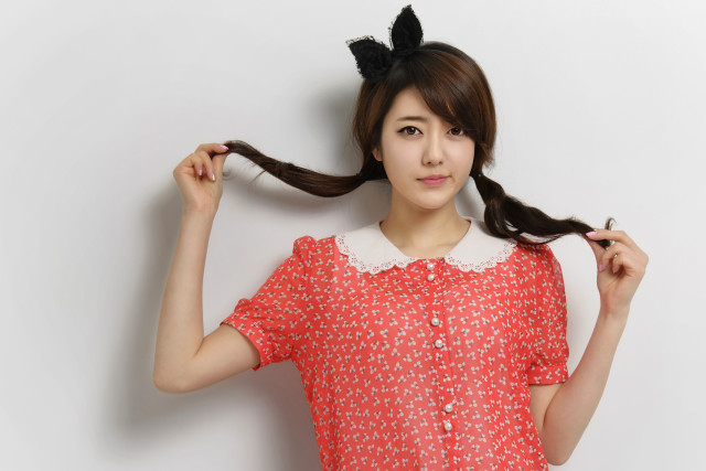 Woman ponytail holding hair posing free wallpaper for desktop - medium preview image