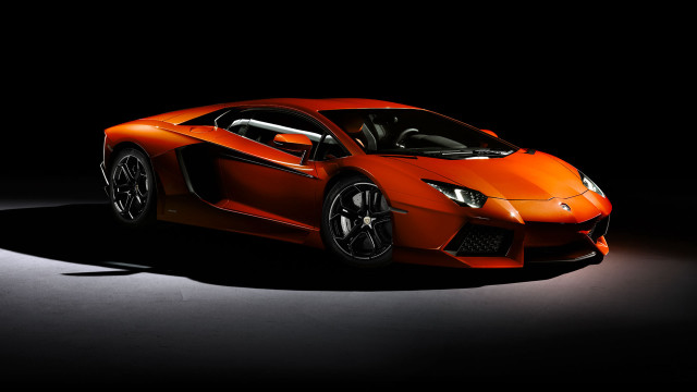 Orange sports car dark room #15 free wallpaper for desktop - medium preview image