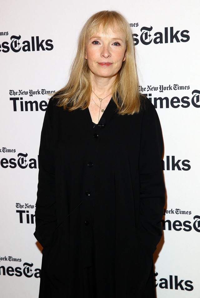 Woman white wall black shirt free wallpaper for mobile - medium preview image